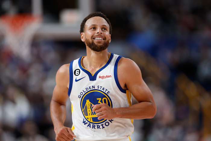 Stephen Curry smiles after a made shot.